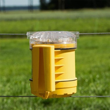 Close-Up of Installation of FoxLights on a Field Fence